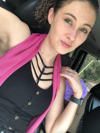 Reviewer with a pink towel around their neck