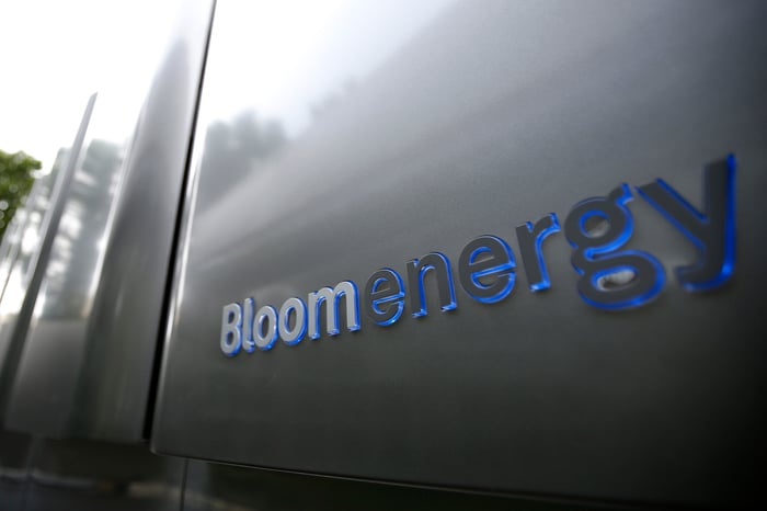 Bloom Energy logo in blue and silver on its grey metallic server.