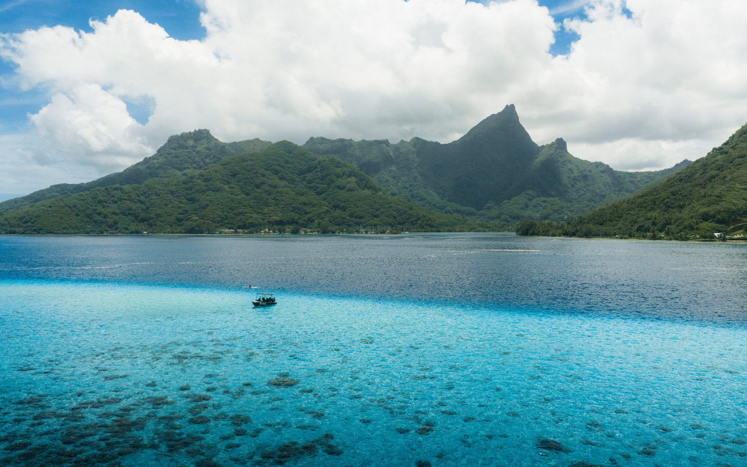 A 45-minute ferry from Tahiti, Mo'orea rises up out of the sea in a thick, spiky mass