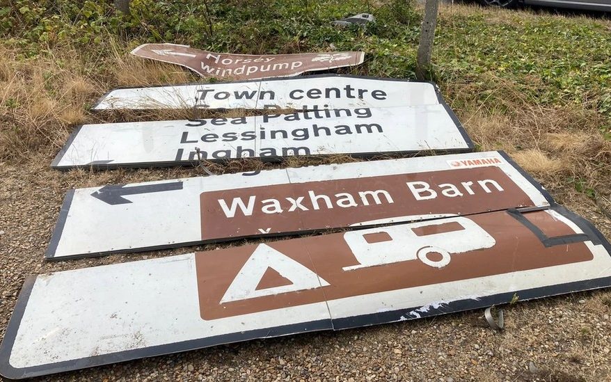Road signs on the ground after a crash