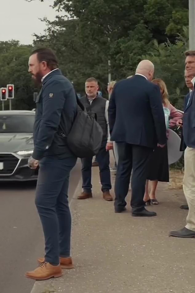 The watching group gasps as they witness the collision, with one quipping: 'She won't be doing that again in a hurry'