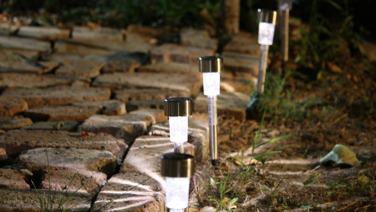 Turn dollar store solar lights into charming outdoor sconces