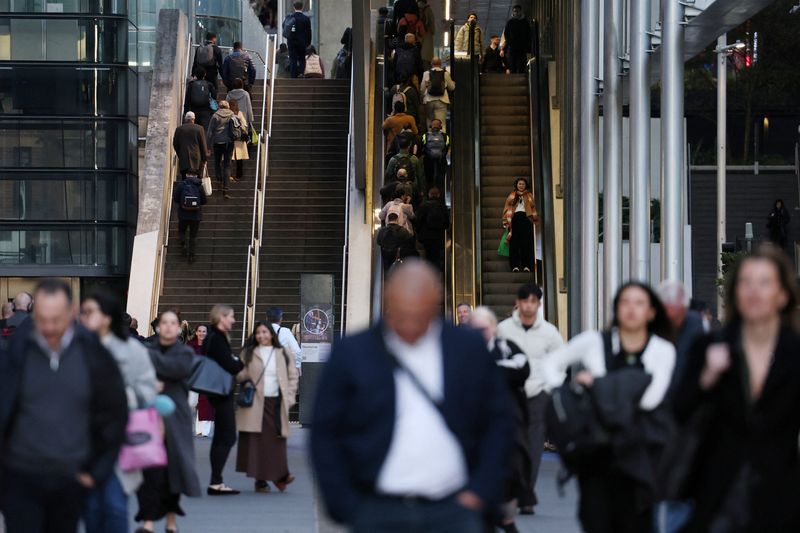 Commuters ride the escalators at Barangaroo in Sydney