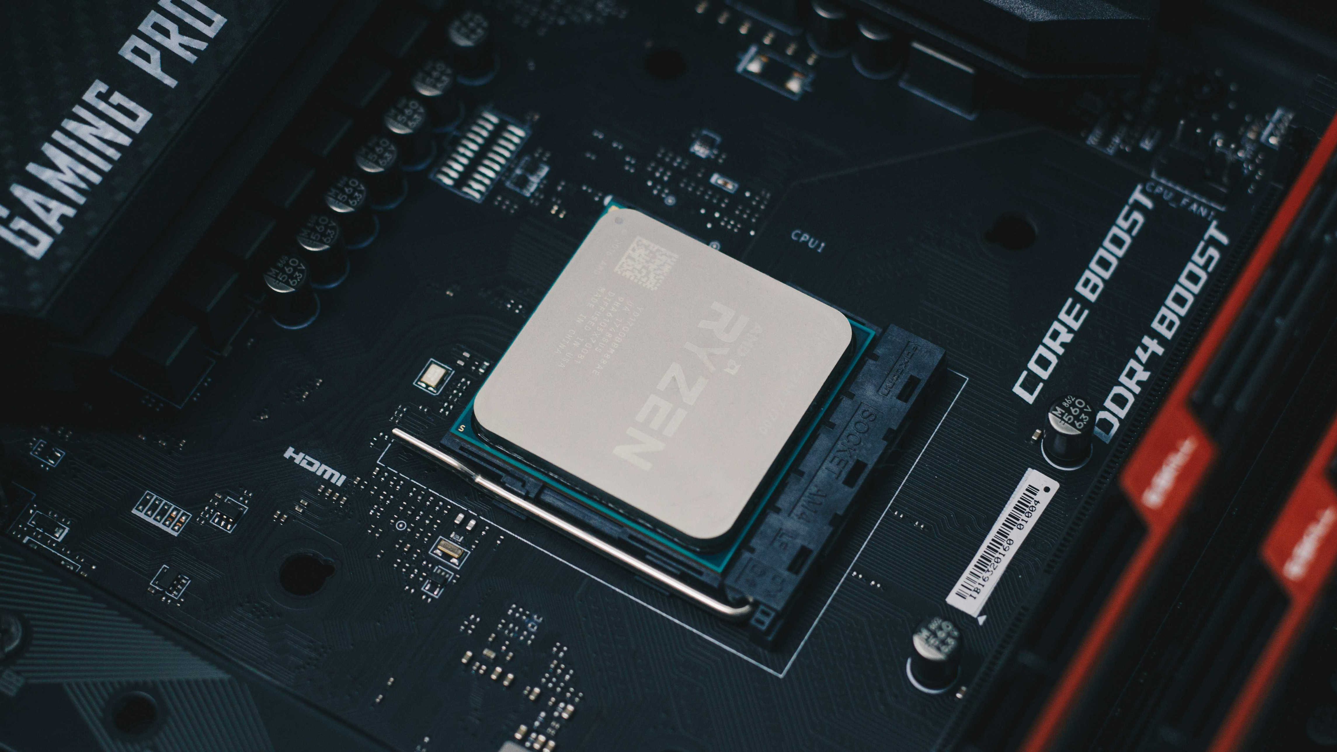 An image of an AM4 processor installed on a motherboard.