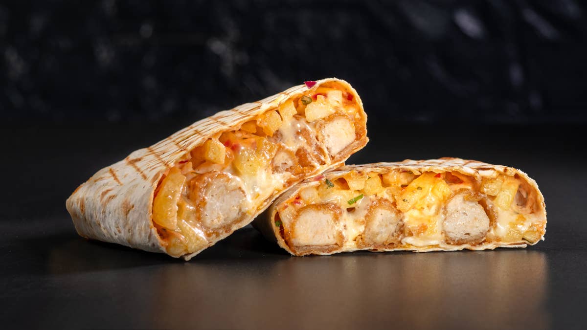 french-tacos-with-chicken-popcorn-served-with-french-fries-on-a-black-background