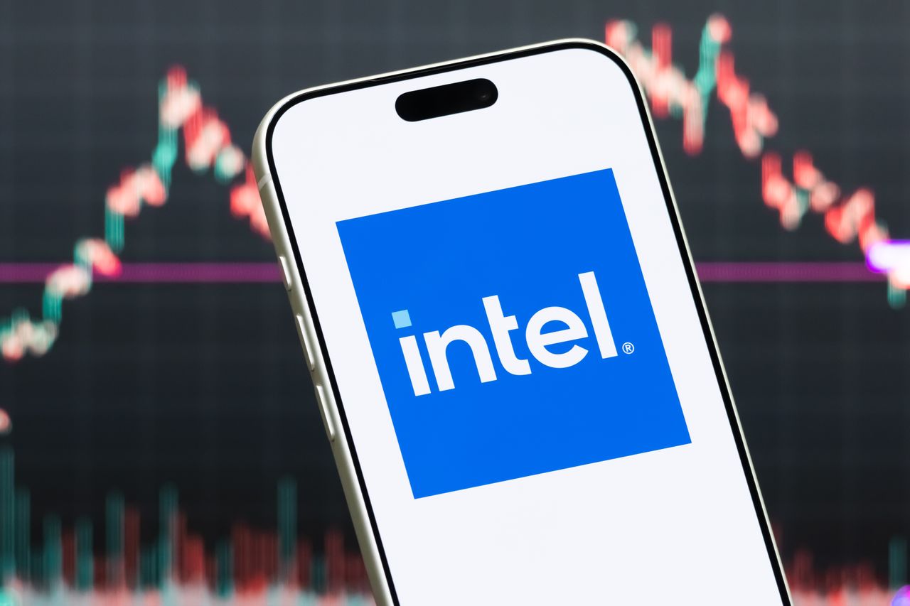 A smartphone displays the logo of Intel Corporation