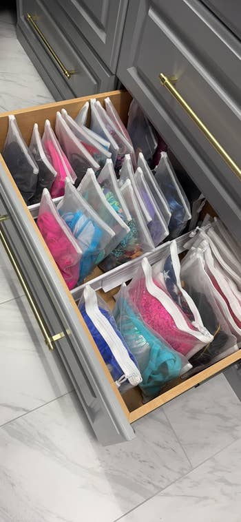 Drawer with organized transparent pouches with contents