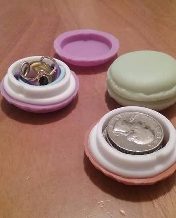 Macaron-shaped containers holding rings and coins