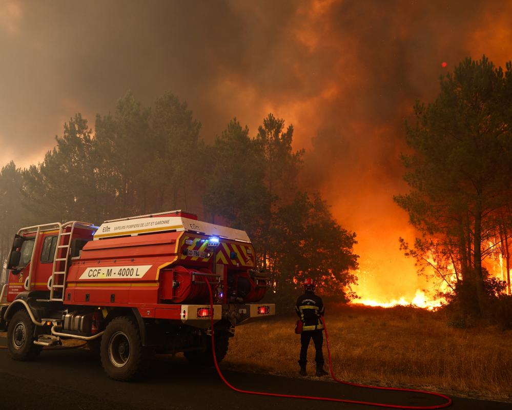 Thousands flee wildfires in France and Spain as temperatures reach extreme levels in southern Europe