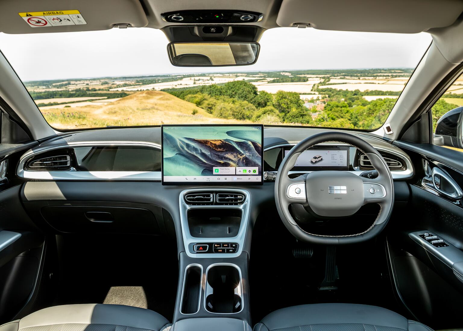 The cabin is dominated by a large screen