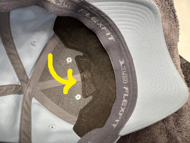 Inside view of a Flexfit cap showing stitching and breathable hat liner