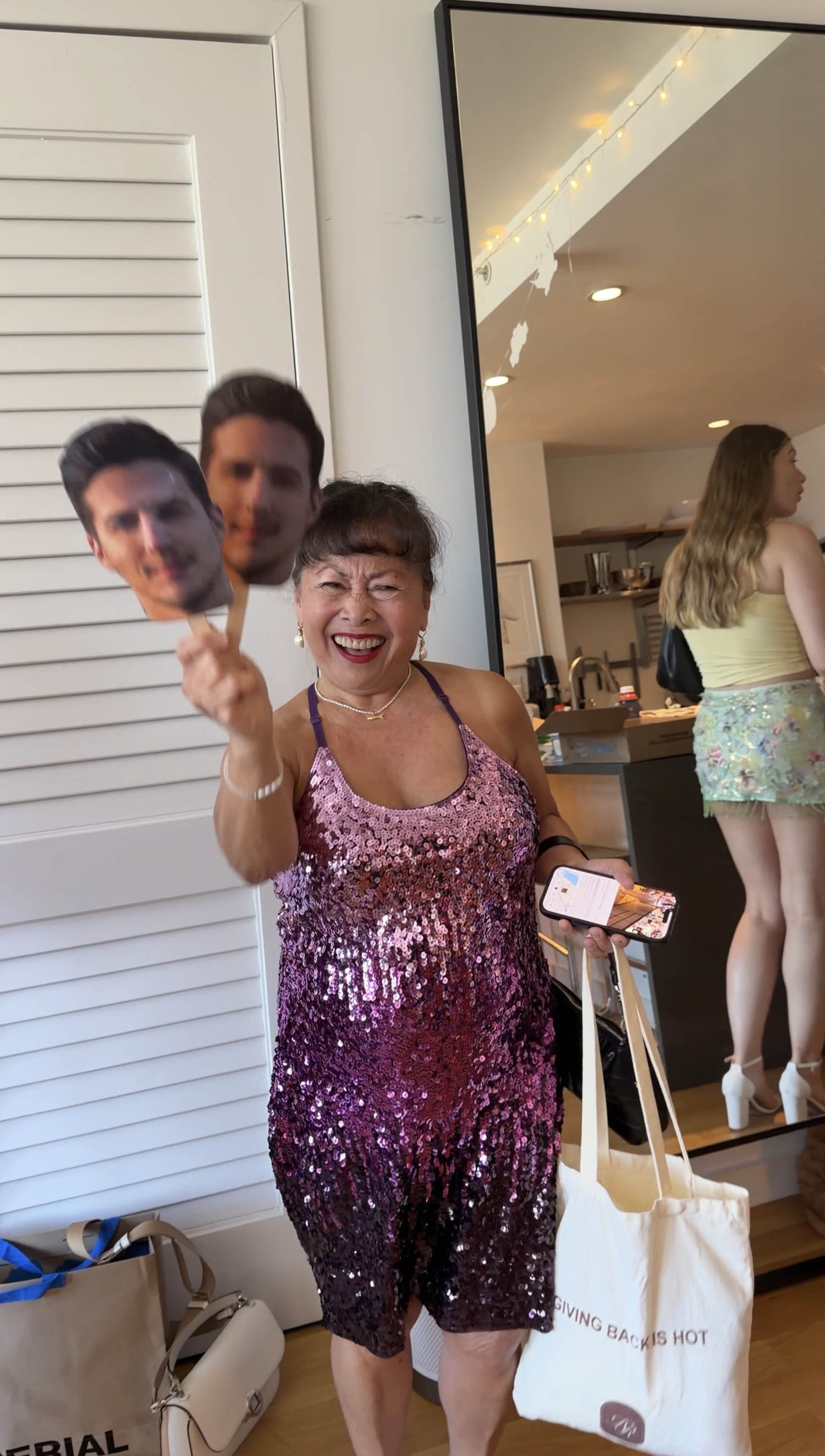 Mariam with photos of Alex's groom, her future son-in-law. (Courtesy Alexandra Bushman)