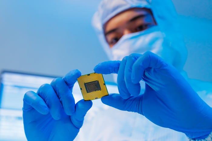 Inspector looking at a microchip.
