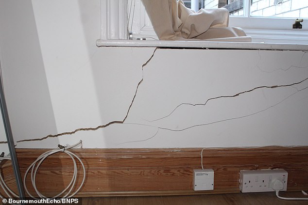 Cracks pictured in the walls of a flat in Westbourne, Dorset. Homeowners have claimed their flats are worthless after major building work by Coffee #1 underneath caused serious damage