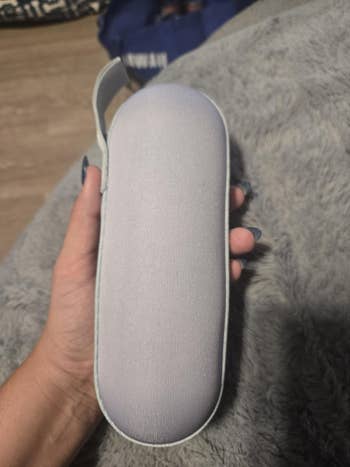person holding umbrella case