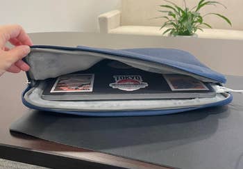 open laptop sleeve with laptop inside