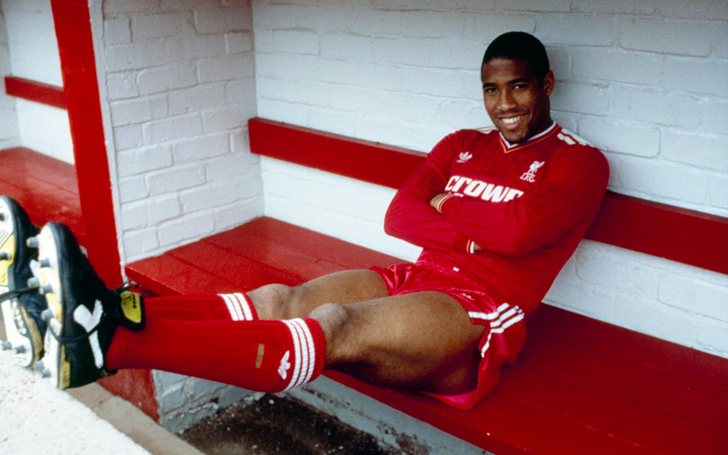 John Barnes poses in the home team dug out for an official photograph shortly after signing for Liverpool, 1987