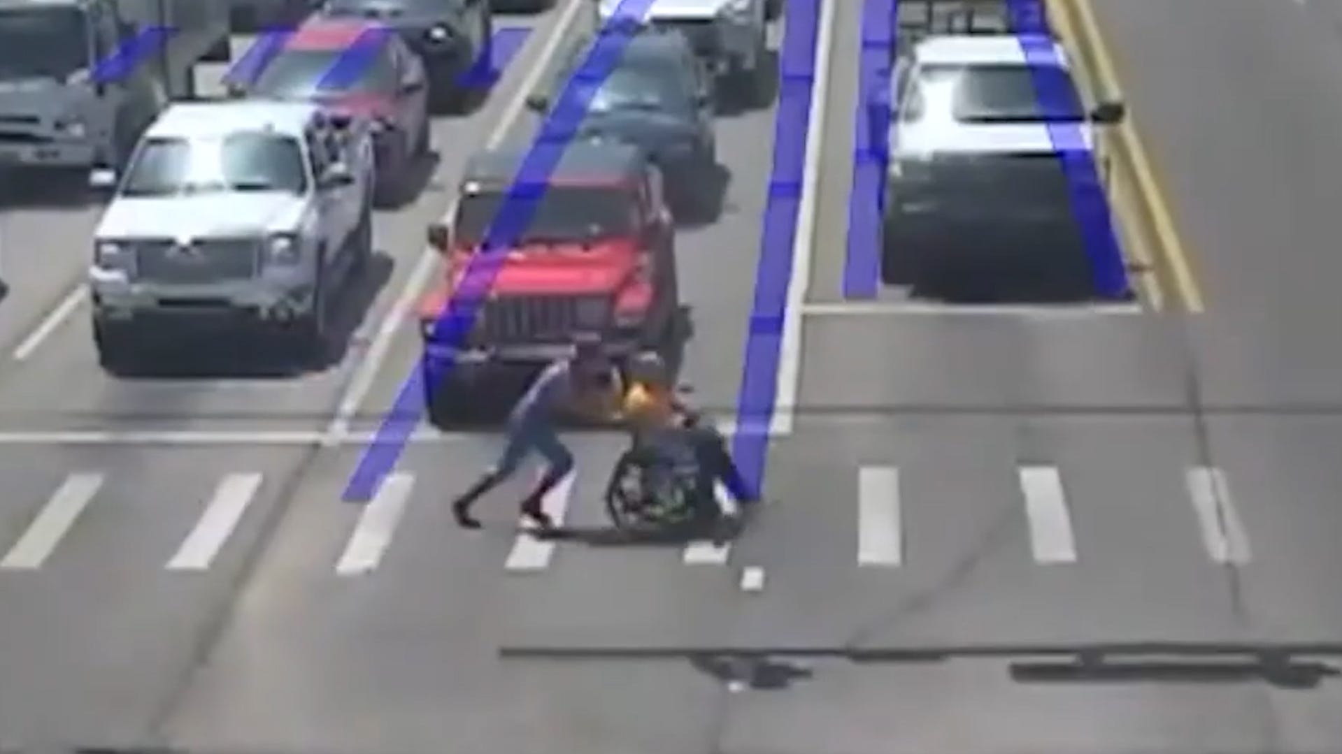 Real-life Spider-Man helps man in wheelchair cross busy intersection