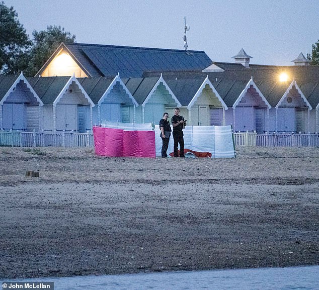 Two police officers are seen on Wednesday night near to the scene where Shelina and Sameeha Rahman died