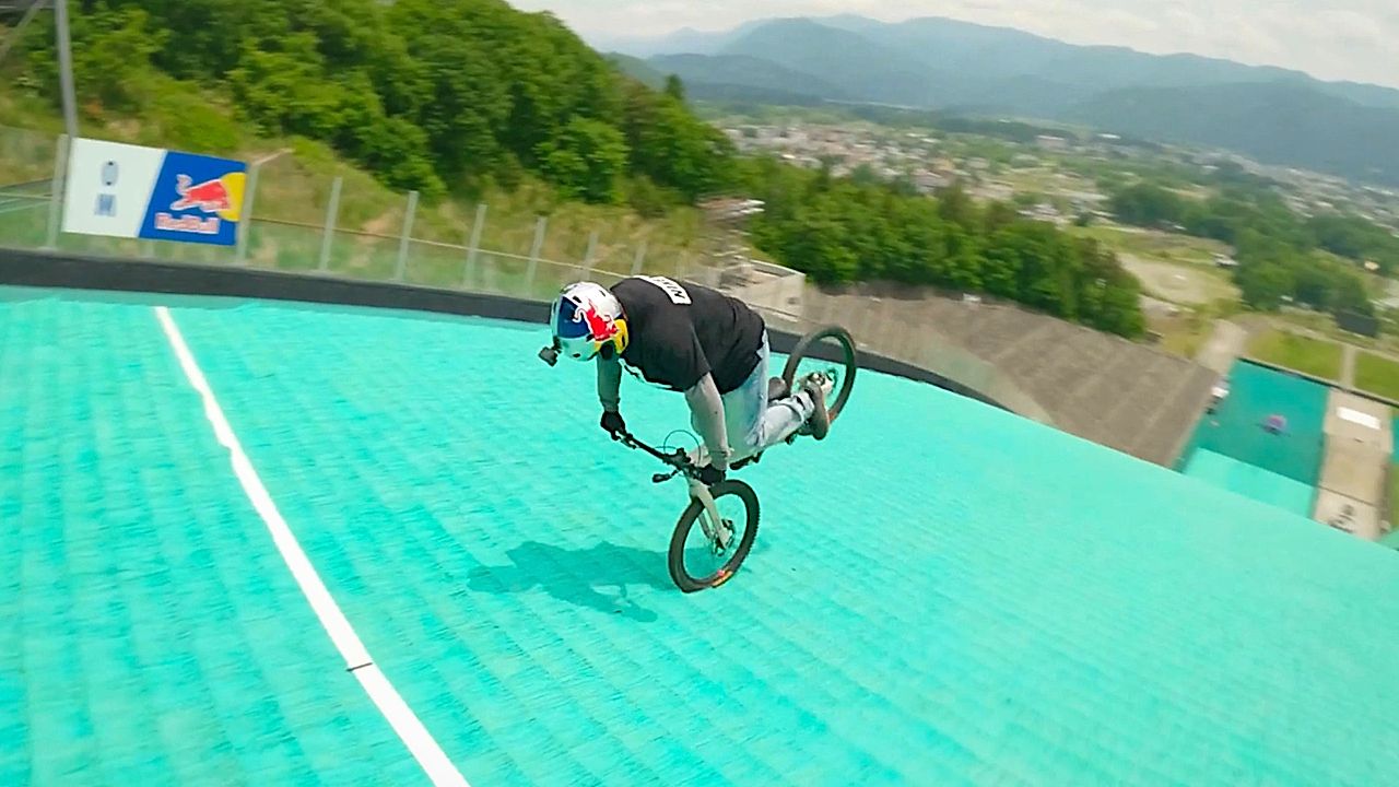 Mountain biker makes history riding down Olympic ski jump backwards on ...
