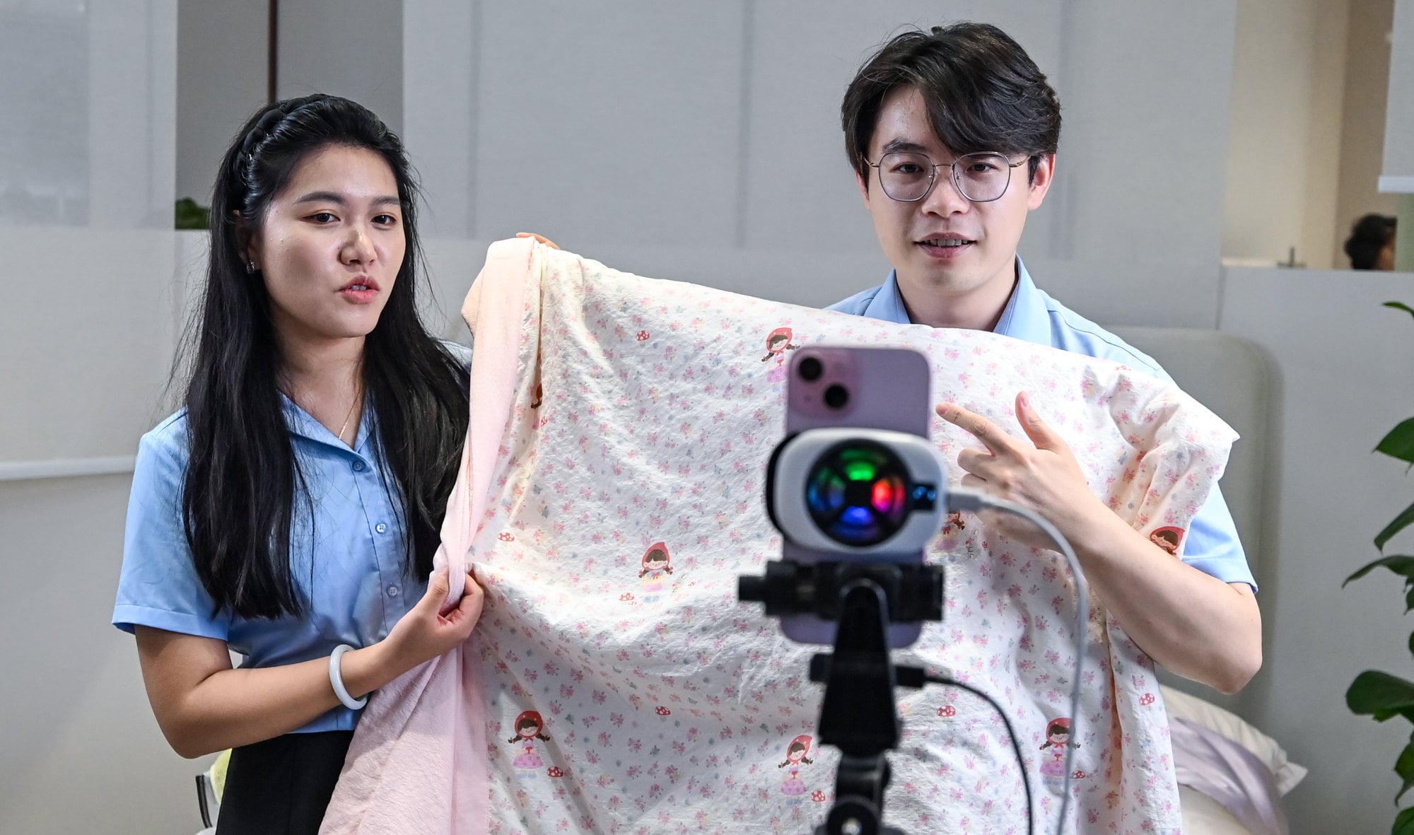 Employees promote products via live-streaming in Jiangsu Yueda Textile Group in Yancheng city, Jiangsu province, on Saturday. Photo: Xinhua