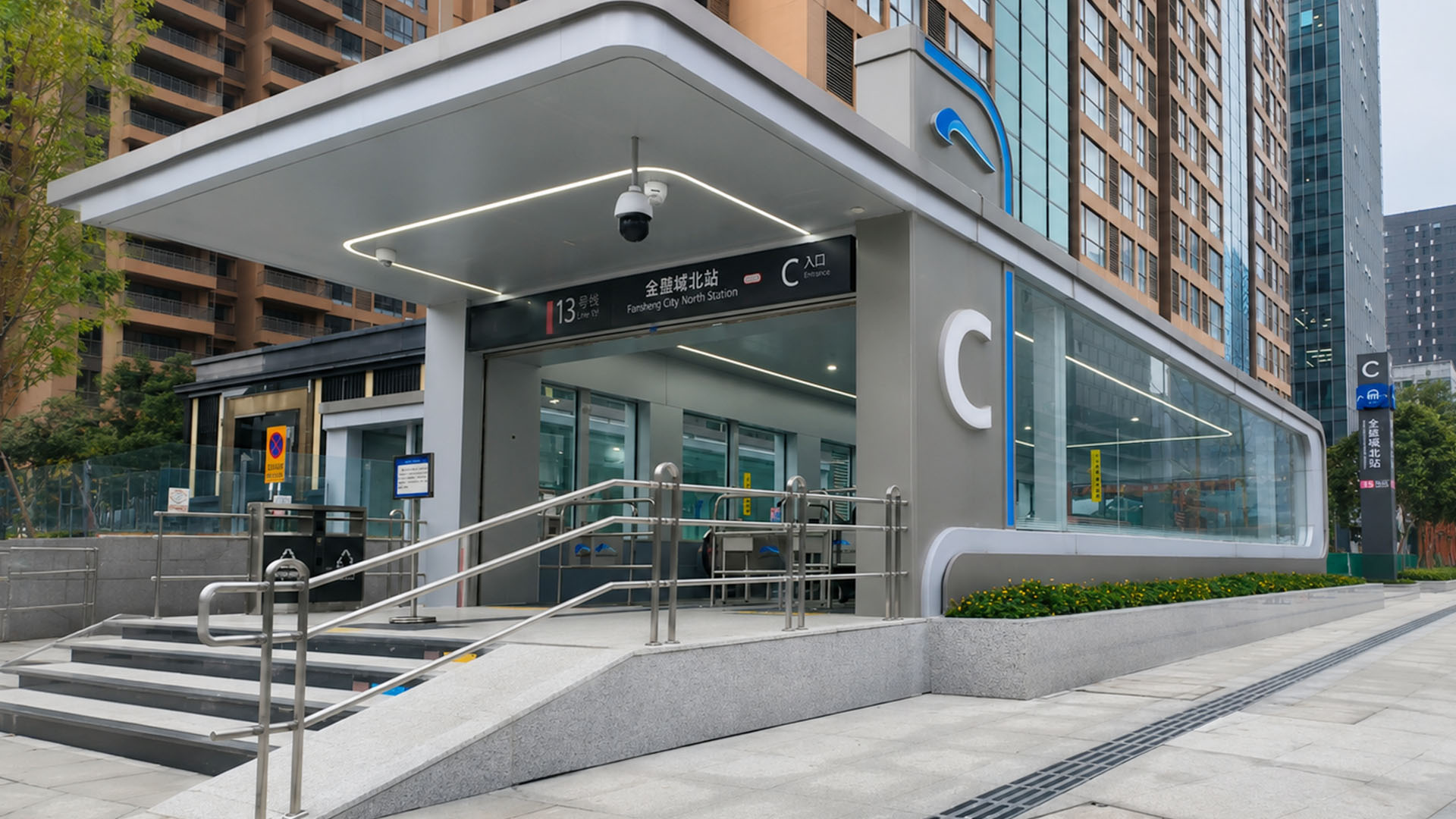 Modern transit entrance blends with contemporary architecture across a ...