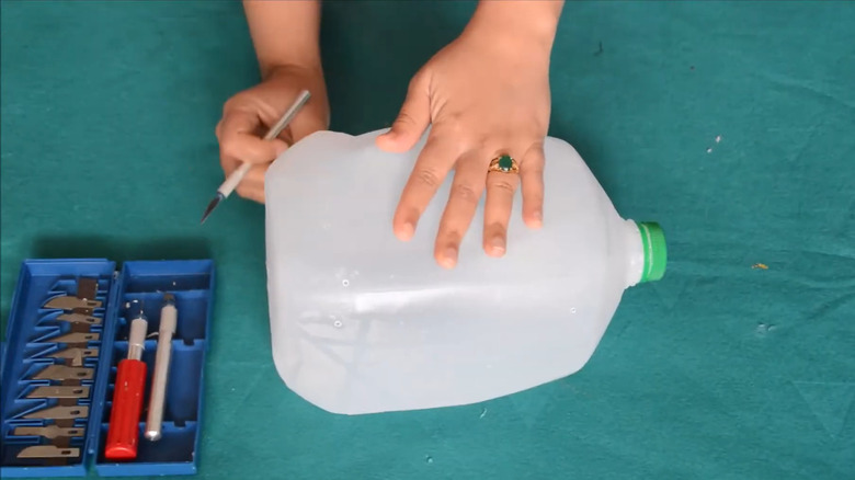 Use an old milk jug to create adorable countertop storage with this ...