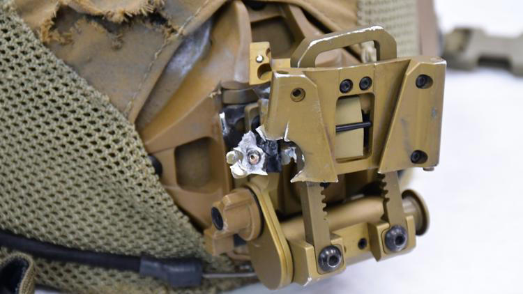 SWAT member's helmet struck by gunfire during exchange with barricaded ...