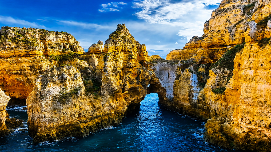 The golden sea cliffs of Portugal’s Algarve coast