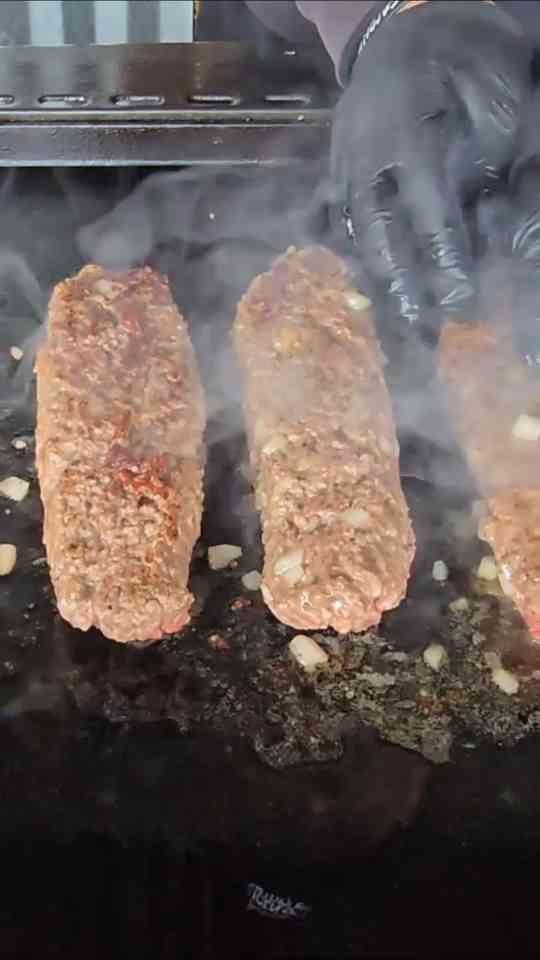 How melted cheddar takes homemade burger dogs to another level
