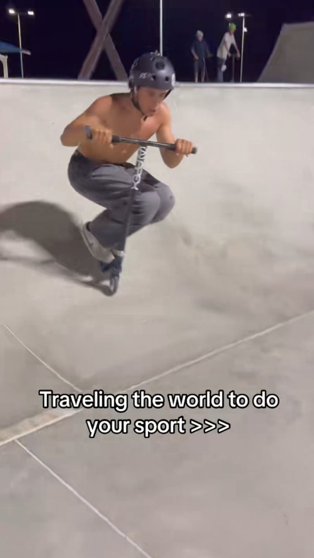 Scooter rider lands an impressive nighttime trick