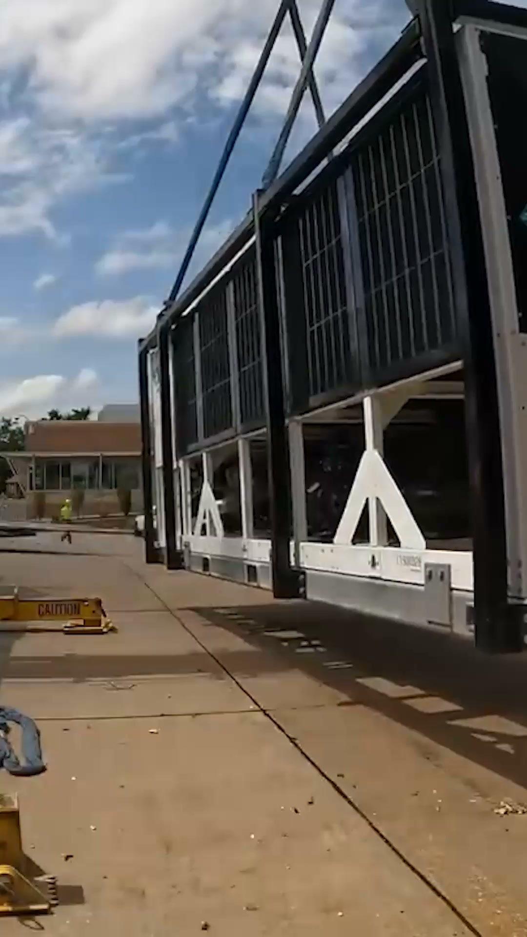 Crane loading heavy machinery