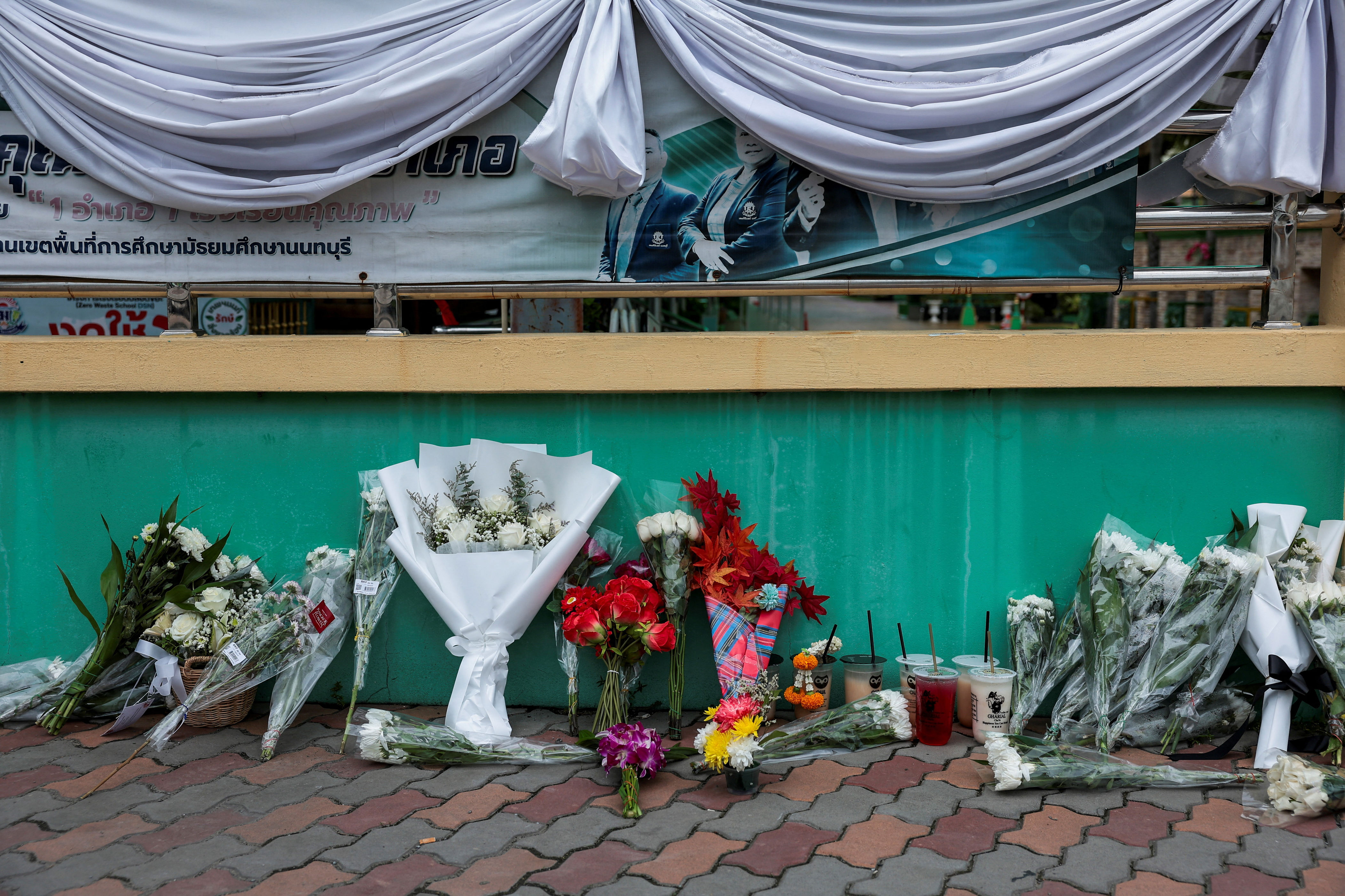 Families retrieve bodies after deadly shooting rampage outside Bangkok