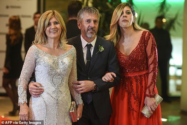 Jorge arrives at son Lionel's wedding in 2017 with his wife Celia (L) and daughter Maria (R)