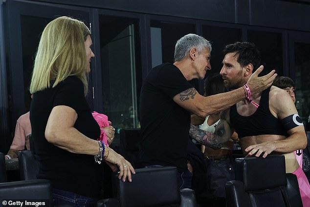 Messi gives his father a hug in Fort Lauderdale in November 2025, as his mother watches on