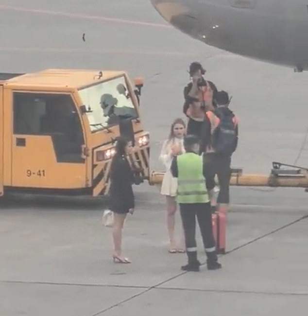 Footage shows the two women hurrying towards an Aeroflot plane at Moscow's Sheremetyevo International Airport as it prepares for take-off