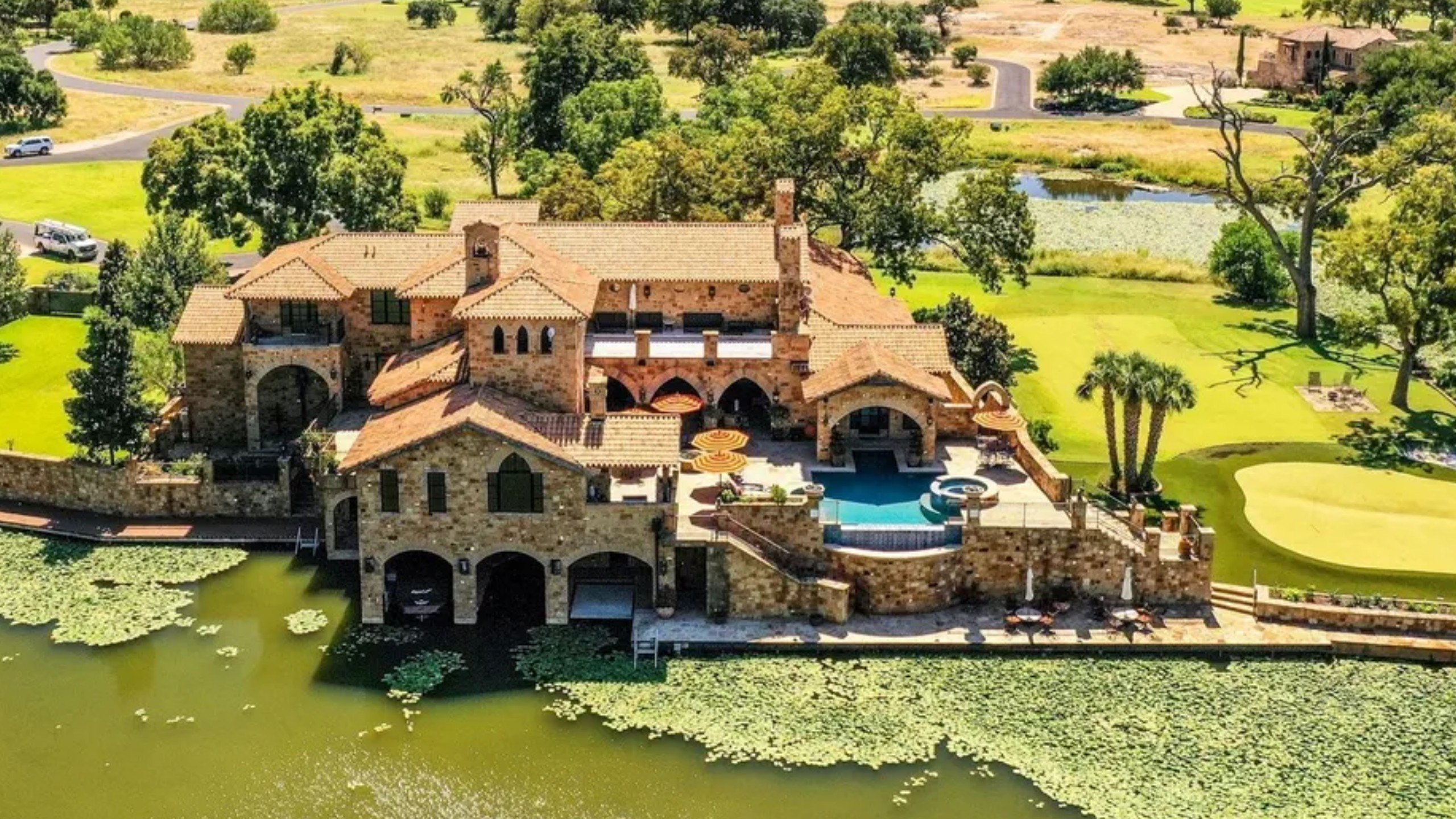 Dramatic stone villa perched on the edge of Horseshoe Bay comes with boat-in, boat-out access