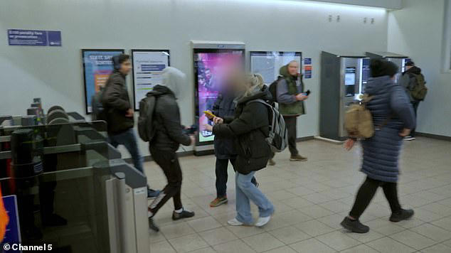 Transport for London investigator Lisa (in light blue trousers) confronts the passenger (with grey hoodie up) as he exits the gate at Seven Kings station with an invalid bank card