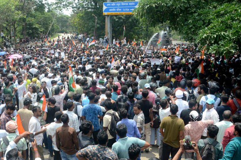 Demonstrators march on the state legislature as police use water cannons to disperse them during a protest against alleged irregularities in the state's civil services examinations, in Ranchi, India, August 10, 2026. REUTERS/Stringer