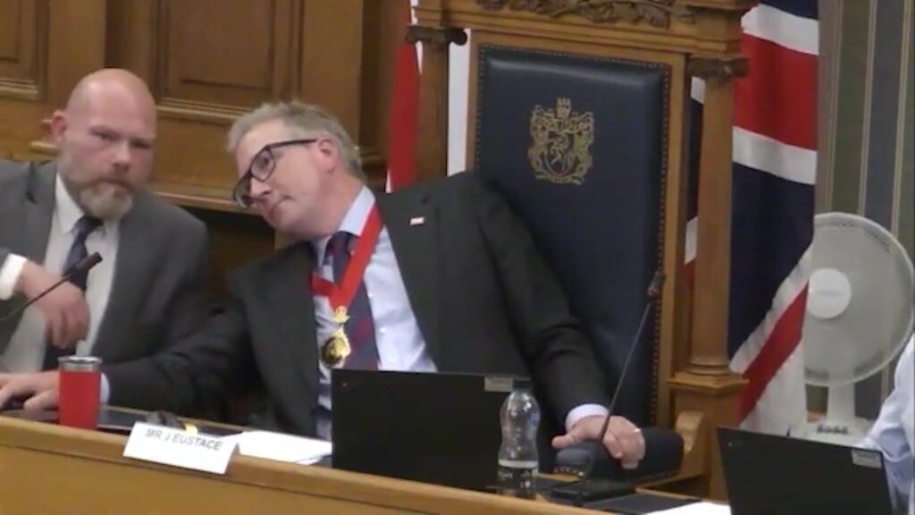 Councillors stage protest by singing national anthem in row with Reform
