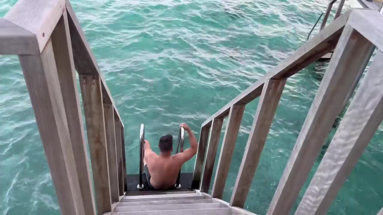 Man slips on stairs while entering water