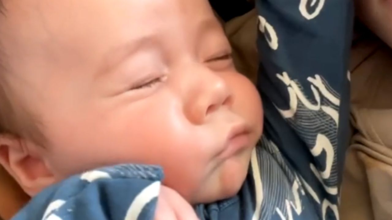 Infant boy delivers intense gaze upon discovering camera at dawn