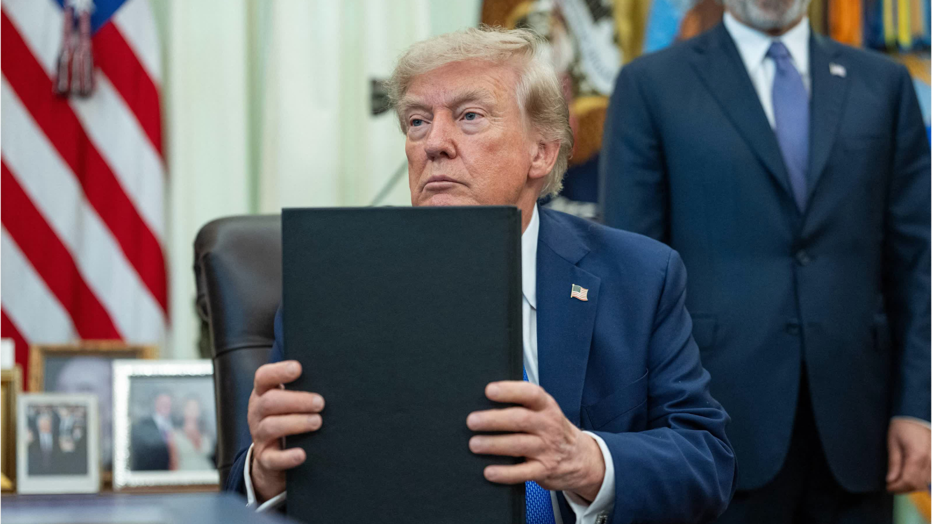 Trump signs order to reduce childhood vaccines