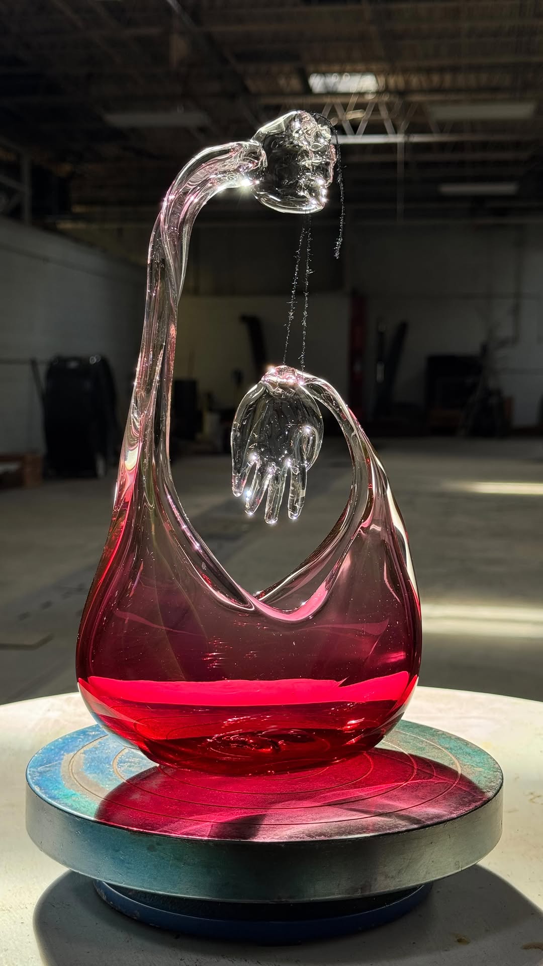 A striking puppet sculpture crafted from glass