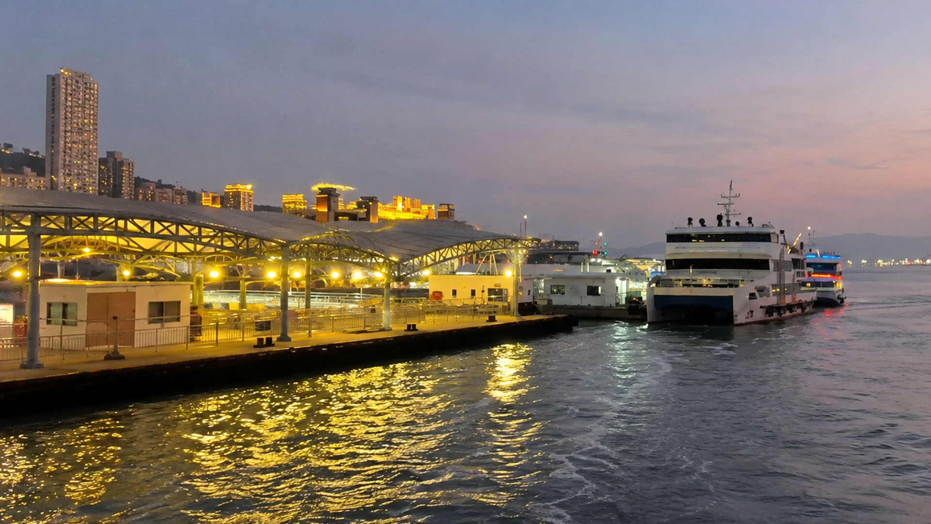 Watching China’s island waterfront light up after sunset