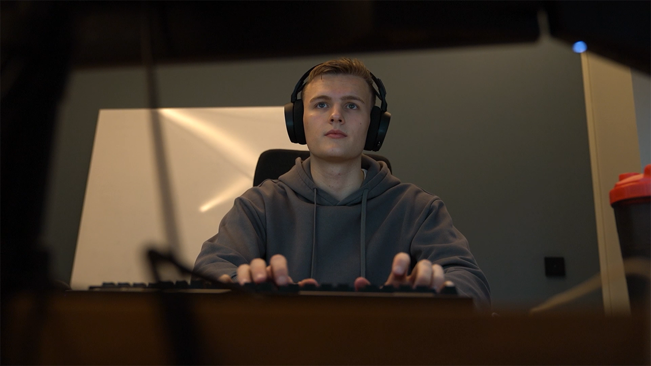 Typing on a computer keyboard while wearing over ear headphones