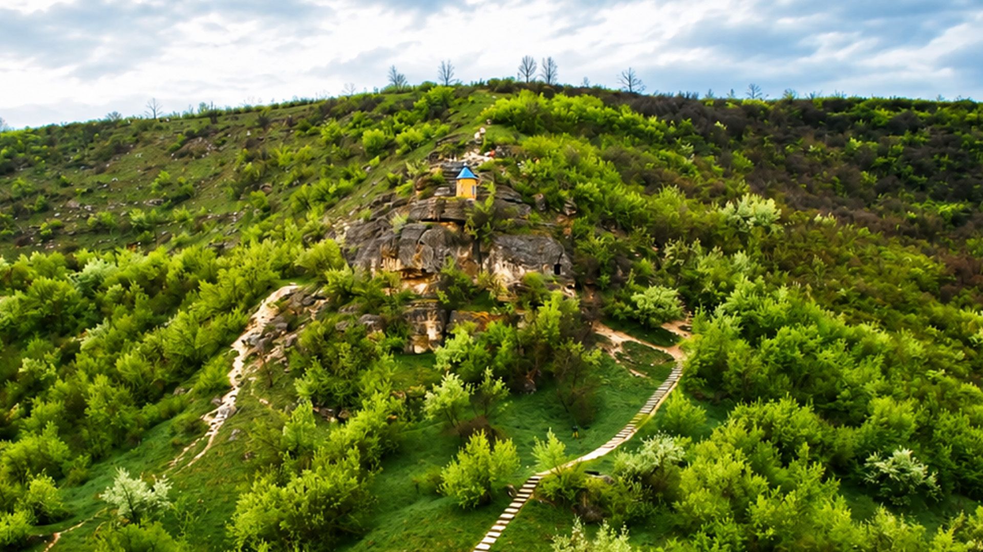 A small church built into a giant rock
