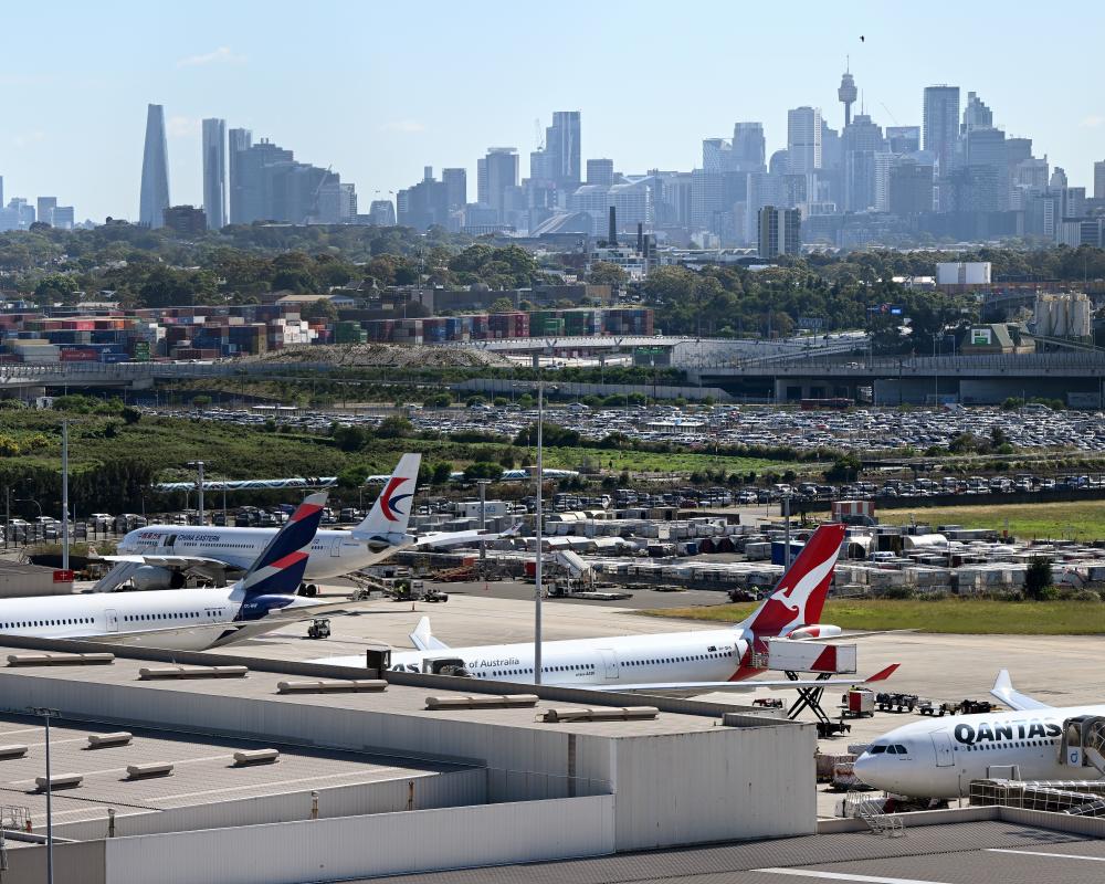 What's behind Sydney Airport's heavy delays and near-miss incident?