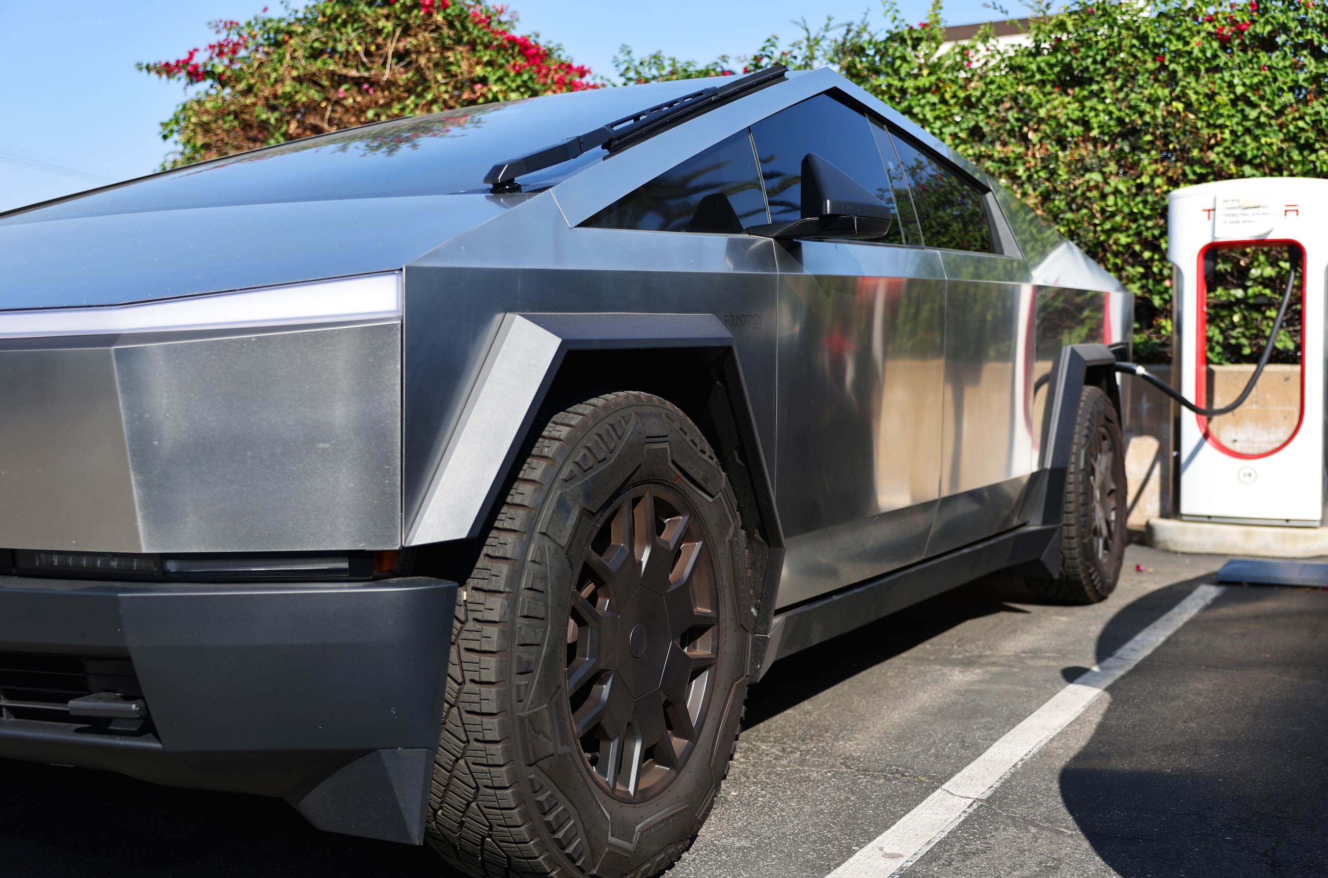Cybertruck owner logged 13,000 miles at $0; Tesla's designer owns V8 ...