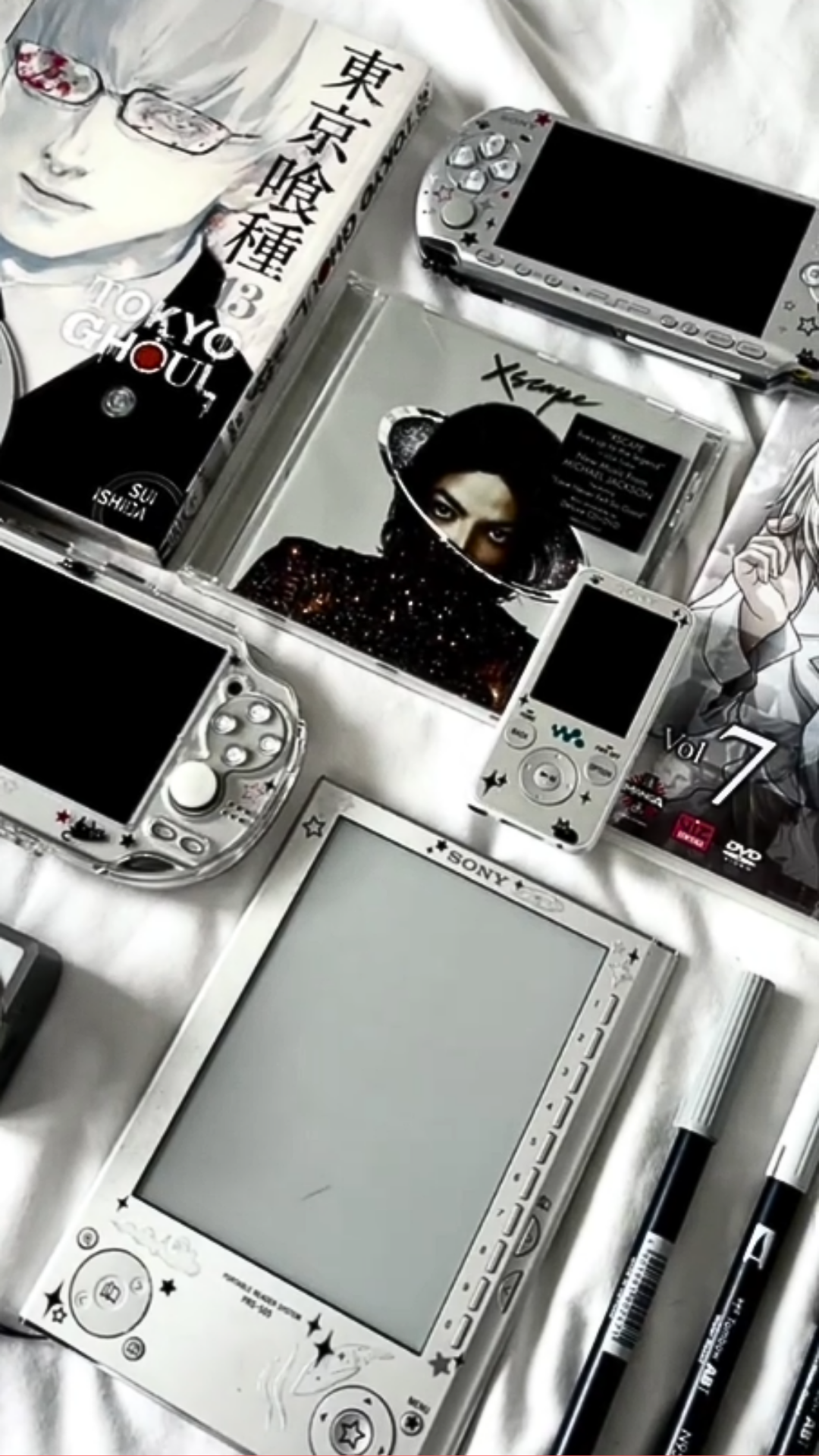 Retro geek gaming setup featuring Tokyo Ghoul and PSP